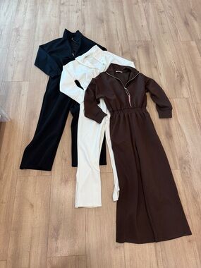 Three Long-Sleeve Zip Jumpsuits in Black, Cream & Brown